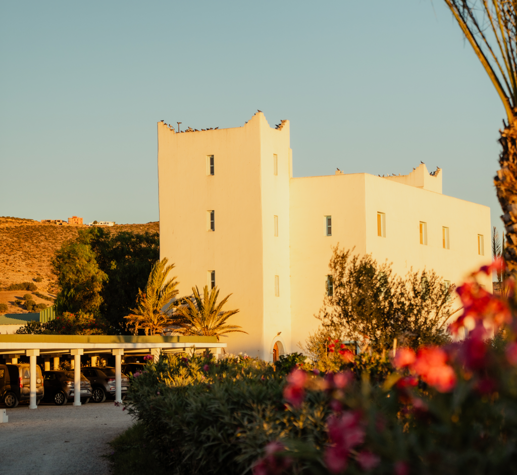 La Palmeraie Hotel from the side, flowers and landscape