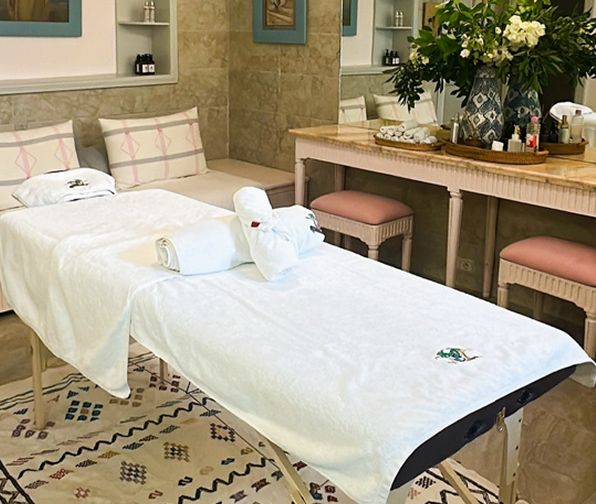 Massage room with a massage bed, cozy room